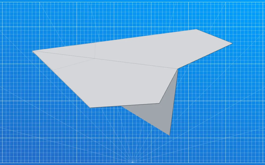 The finished Raven paper airplane, on a blueprint