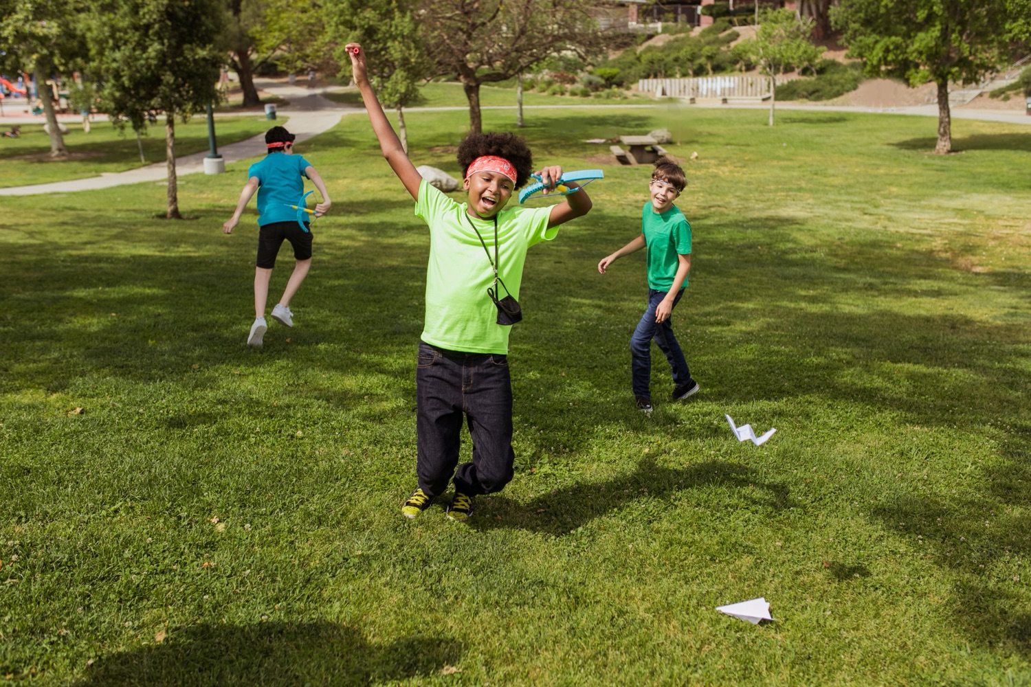 A kid leaping with joy after a good throw